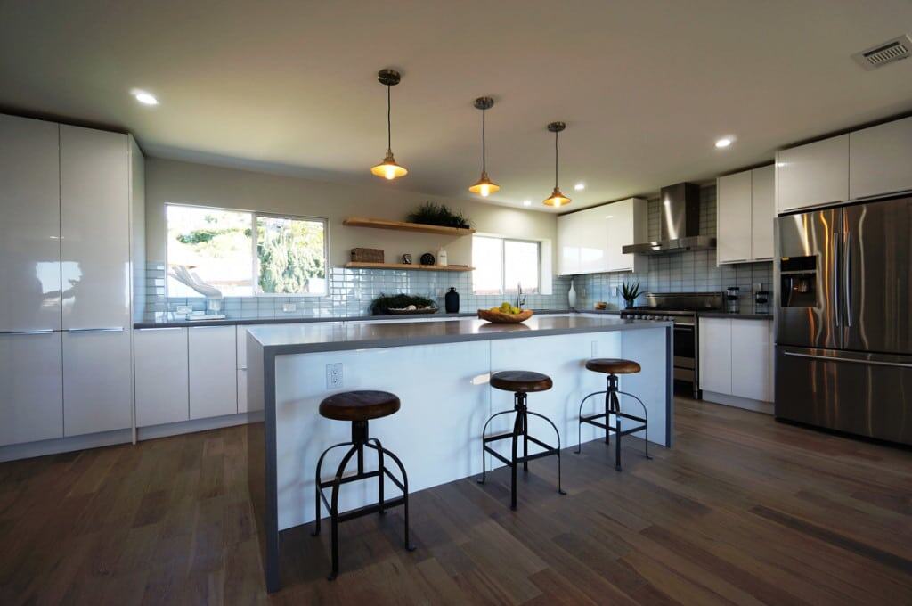 Modern kitchen with waterproof PVC cabinets and island by Evolux Cabinets, Brevard County Florida.