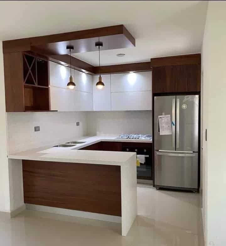 Compact modern kitchen with waterproof PVC and StarBoard cabinets by Evolux Cabinets in Brevard County, Florida.