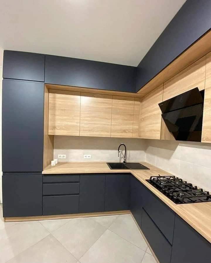 Modern Dark blue and oak waterproof PVC kitchen cabinets by Evolux Cabinets in Brevard County, Florida.