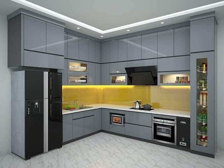 Modern waterproof gray PVC kitchen with yellow backsplash by Evolux Cabinets in Brevard County, Florida.