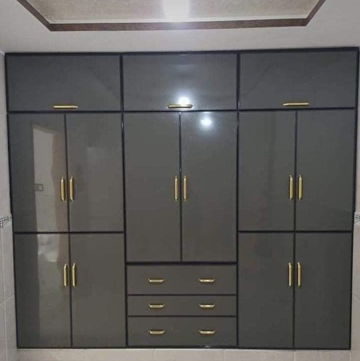 Gray waterproof PVC closet with gold handles designed by Evolux Cabinets in Brevard County, Florida.