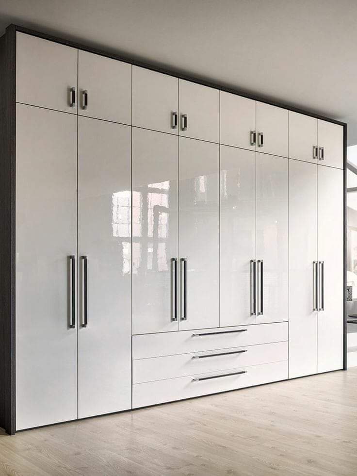 White glossy waterproof PVC closet with chrome handles by Evolux Cabinets in Brevard County, Florida.