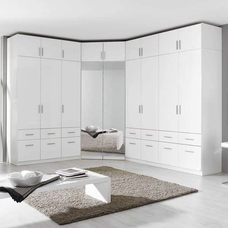 Modern white corner closet with mirrored doors and waterproof PVC finish by Evolux Cabinets.