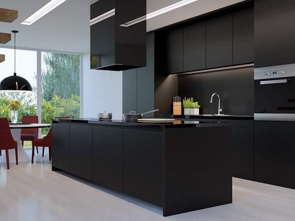 Modern matte black kitchen with central island and waterproof PVC cabinets by Evolux Cabinets.