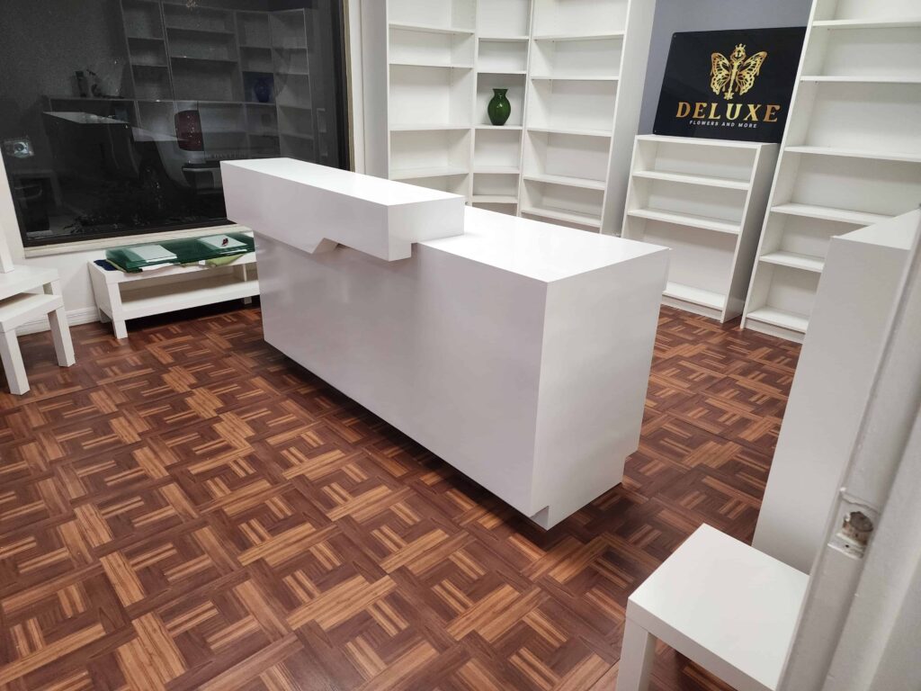 Modern white PVC commercial desk with drawers and wide workspace – waterproof and durable furniture by Evolux Cabinets.